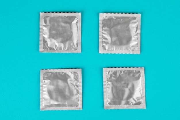 Condom on a blue background. The concept of safe sex.