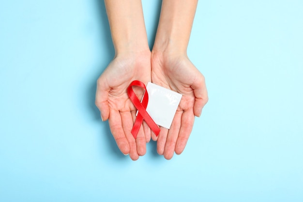 Condoms and other contraceptives on a colored background