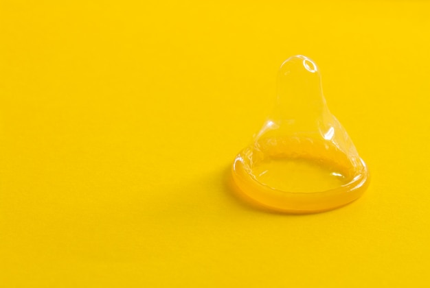 Condoms on yellow