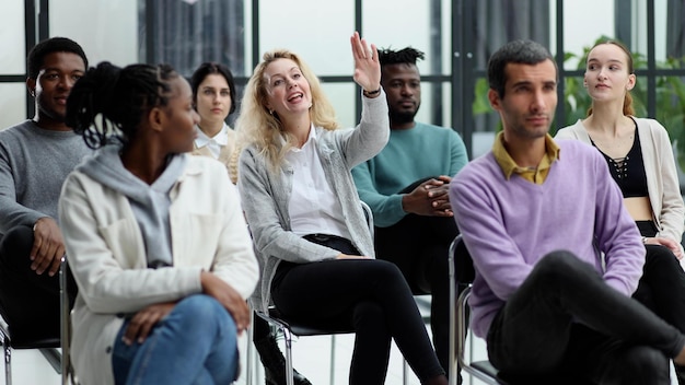 Conducts business training with a group of young people