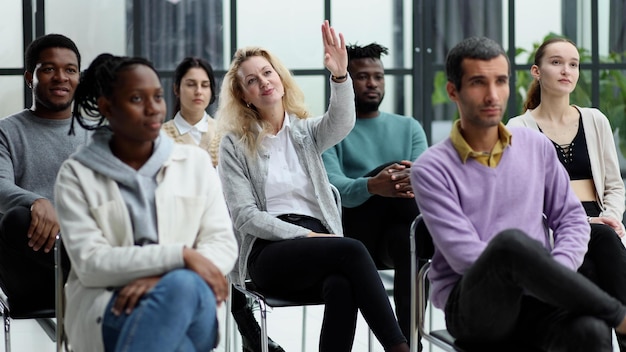 Conducts business training with a group of young people