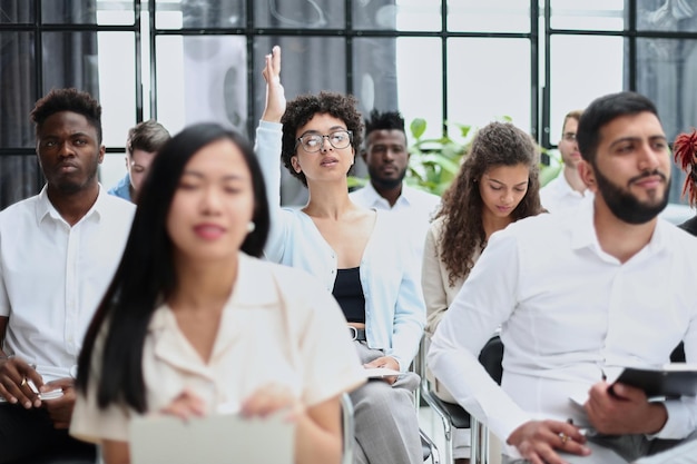 Conducts business training with a group of young people