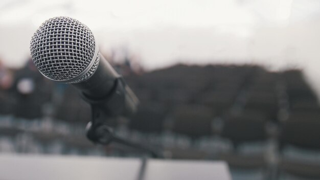 Conference of lecture - microphone on stage in auditorium waiting for performances, close up view