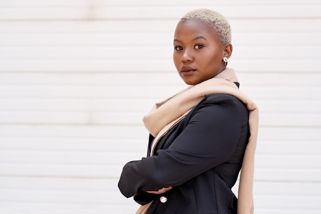 Confidence allows you to feel power like no other Portrait of a young businesswoman standing against a white background