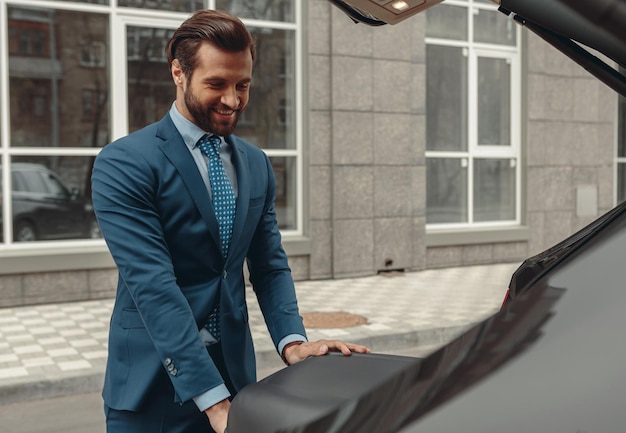 Confidence smiling business owner in suit is going to journey by automobile