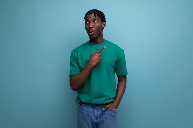 Confident american young man in tshirt pointing finger