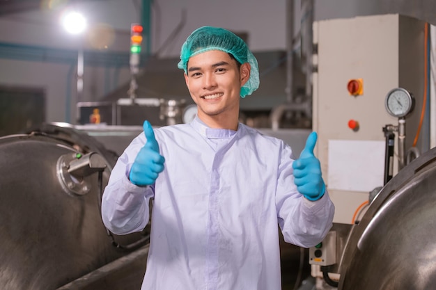 Confident Asian man employee working in food Factory industry Asia Worker work in food factory