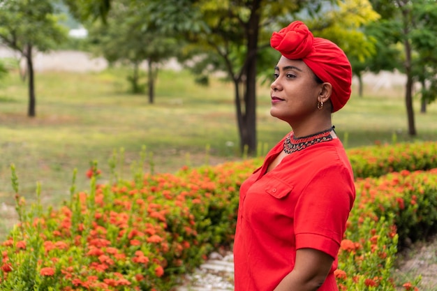 Confident black woman standing in park