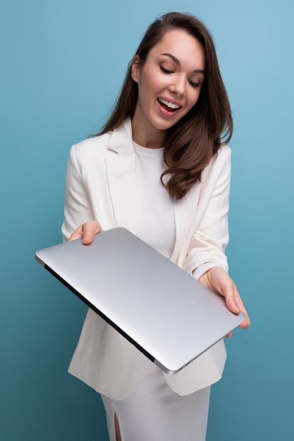 Confident brunette business woman with laptop