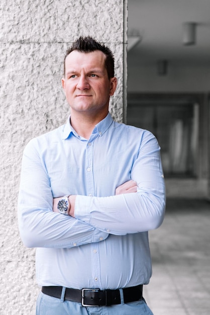 Confident business man standing in the city looking and dreaming of future business success