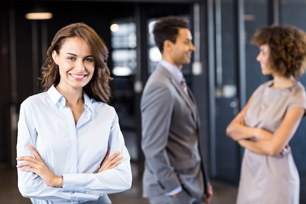 Confident business woman in office with his coworkersblack