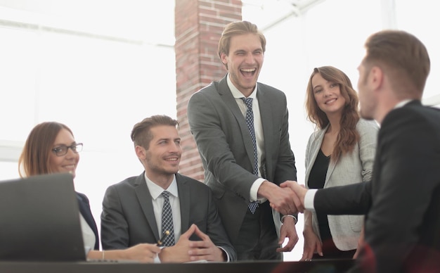 Confident businessmen sitting by table during consultation