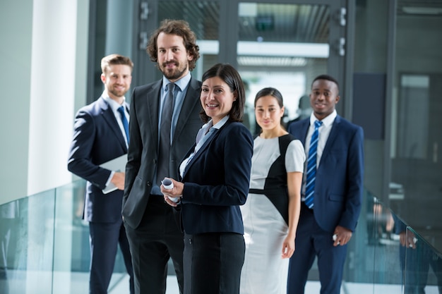 Confident businesspeople standing in office