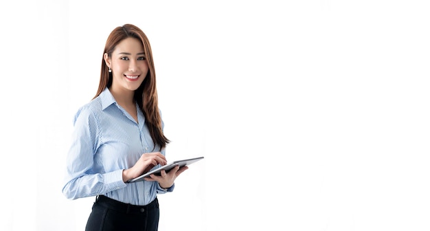 Confident businesswoman holding tablet and smiling at the camera isolated on white background