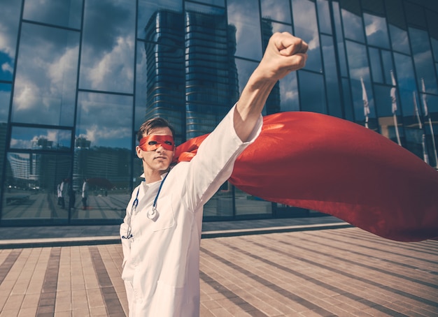 Confident doctor in a superhero Cape