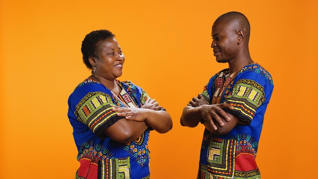 Confident married people posing on camera with colorful apparel