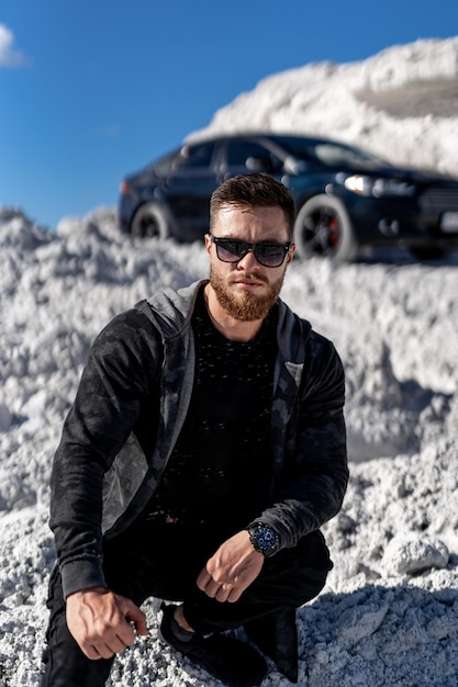 Confident stylish man with sunglasses Attractive young man in trendy clothing