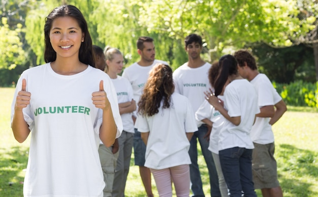 Confident volunteer gesturing thumbs up 