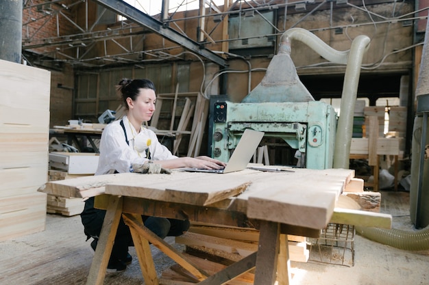 Confident woman working as carpenter