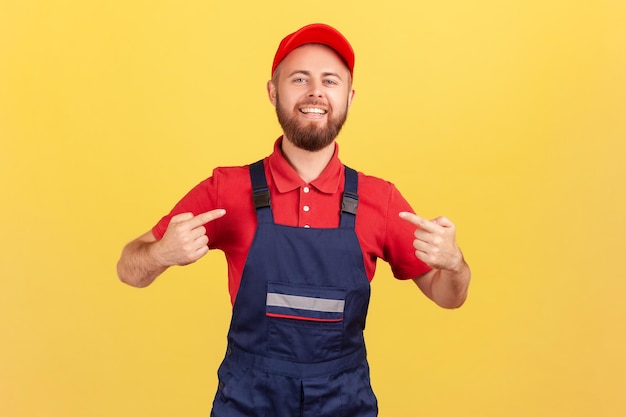 Confident worker man standing and pointing at himself bragging about the result of his work