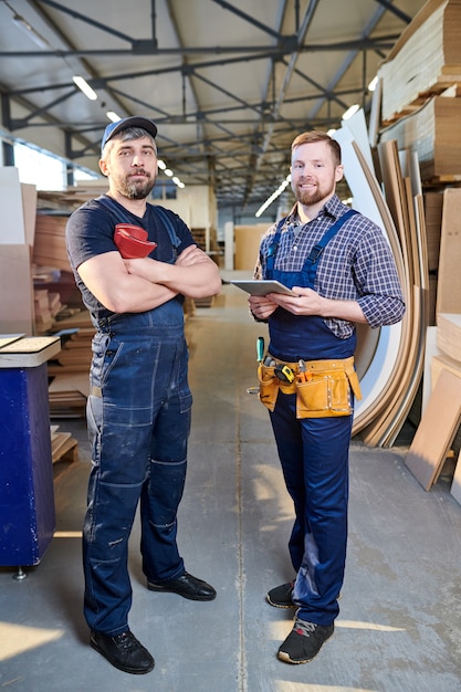 Confident workers in overalls