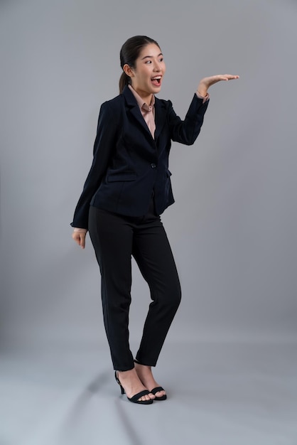 Confident young asian businesswoman in formal suit holding hand Enthusiastic