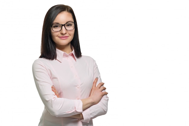 Confident young business woman with crossed arms in glasses pink shirt on white