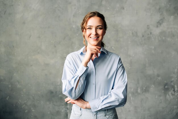 Photo confident young businesswoman in a blue shirt smiles warmly at the camera perfect for showcasing