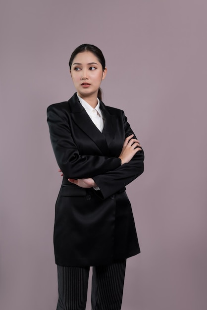 Confident young businesswoman stands on isolated background Enthusiastic