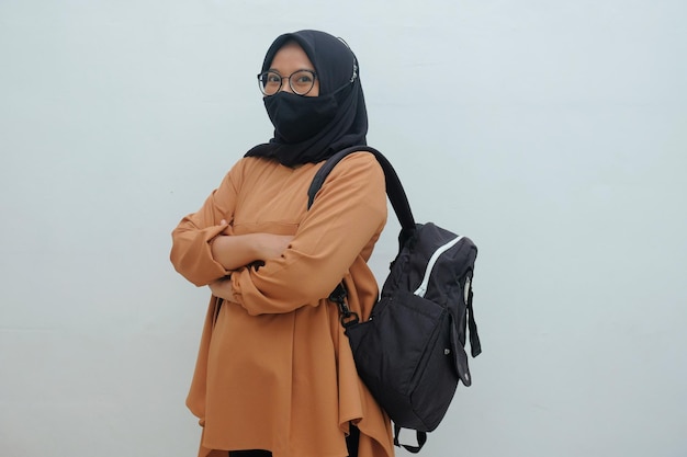 Confident young muslim woman holding bag