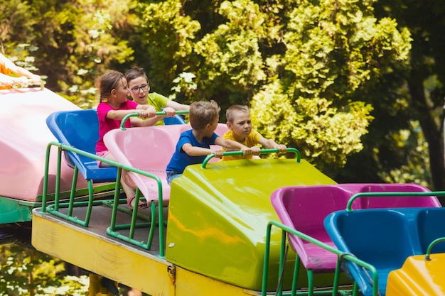 The confused kids ride a roller coasters for the first time