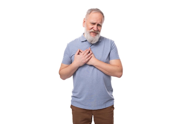 Confused old man with white mustache and beard dressed in basic tshirt and pants