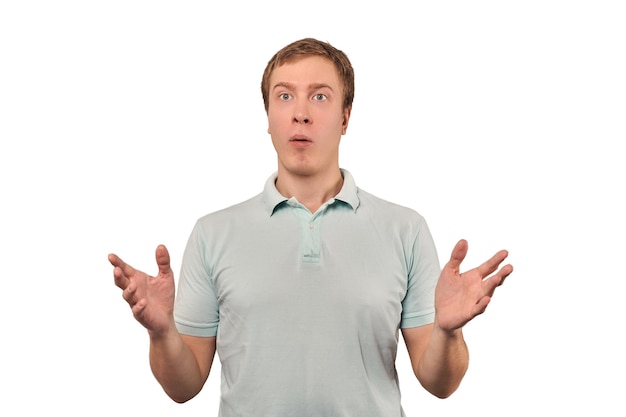 Confused young guy shrugged shoulders guy in casual Tshirt spread arms isolated white background