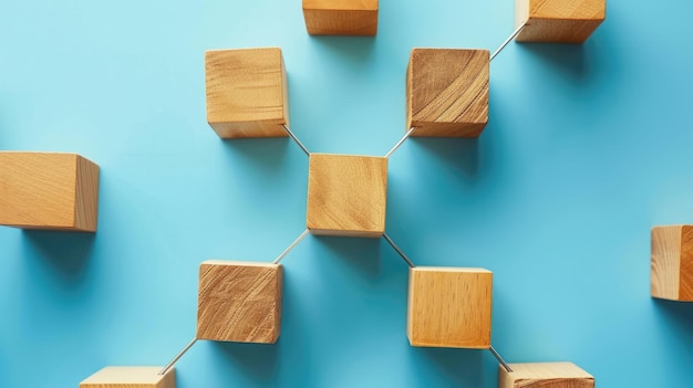 Connected wooden blocks on blue backdrop Teamwork idea