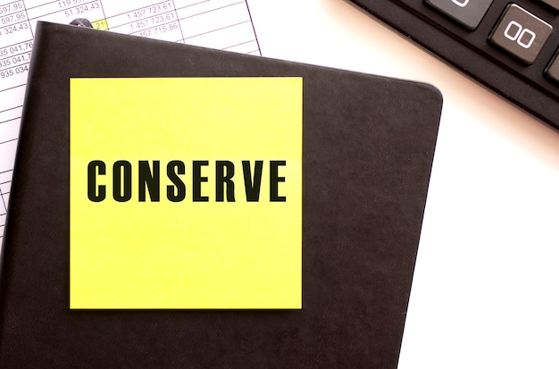 CONSERVE text on a sticker on your desktop. Diary and calculator