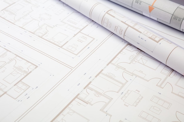 Construction concept Residential building drawings on an office desk