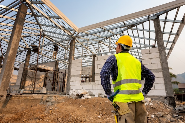 Construction engineer worker,Civil engineer checking work at the construction site, House construction concept.