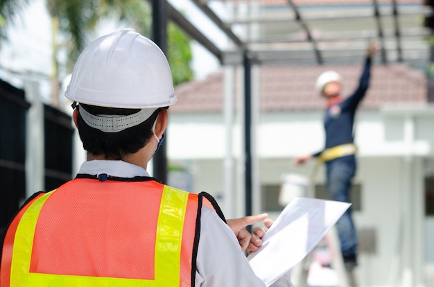 Construction engineers standing at the work site.