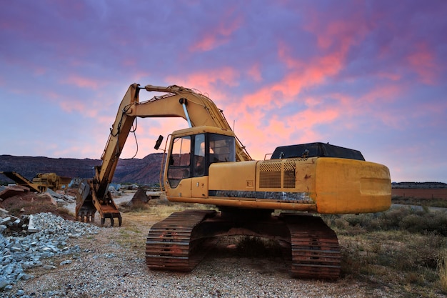 Construction Excavator at Sunrise