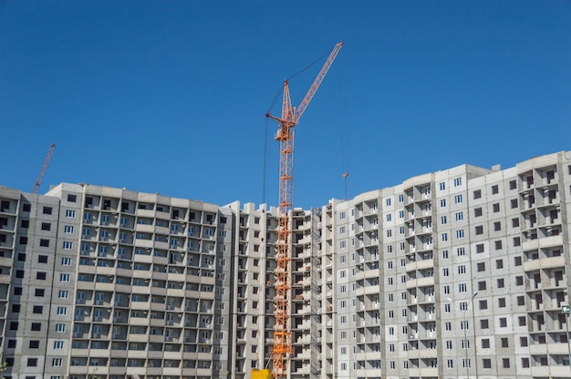 Construction of high-rise houses and tall cranes