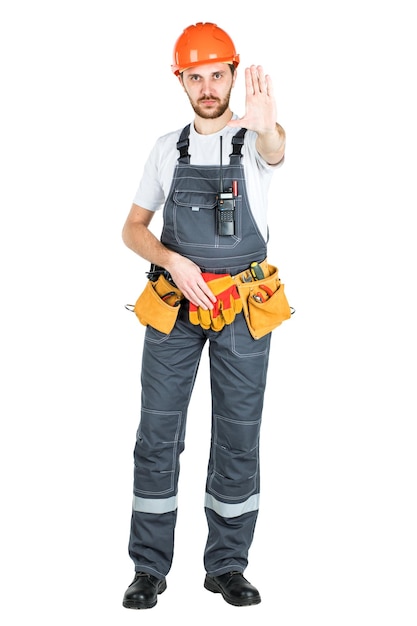 A construction man shows a stop sign isolated on white background