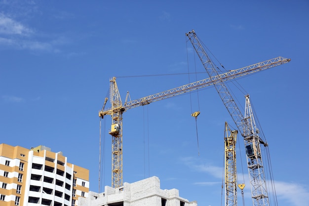 The construction of a multistory building with construction crane