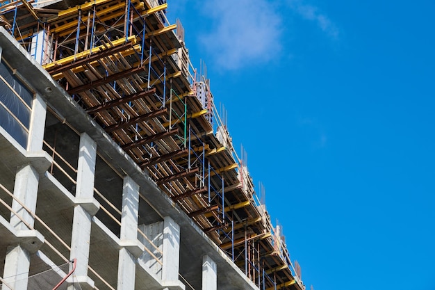 Construction of new building with reinforced concrete floors blue sky copy space