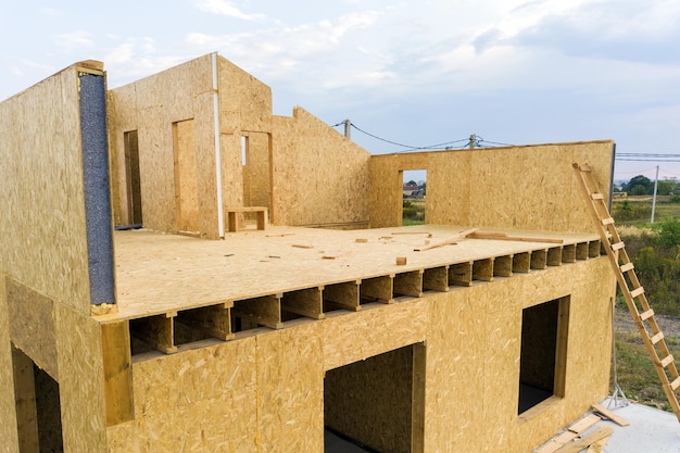 Construction of new and modern modular house Walls made from composite wooden sip panels with styrofoam insulation inside Building new frame of energy efficient home concept