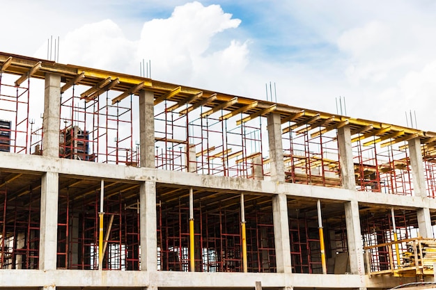 Construction of a new monolithic reinforced concrete house Formwork for pouring the next floor Working at height on a construction site