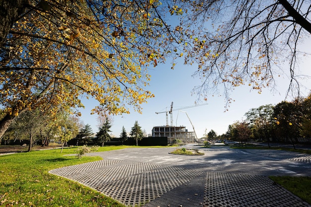 Construction of a new residential area of hig rise buildings near autumn city park