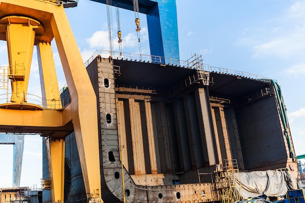 Construction of a new ship hull at the shipyard in Constanta Romania with port crane