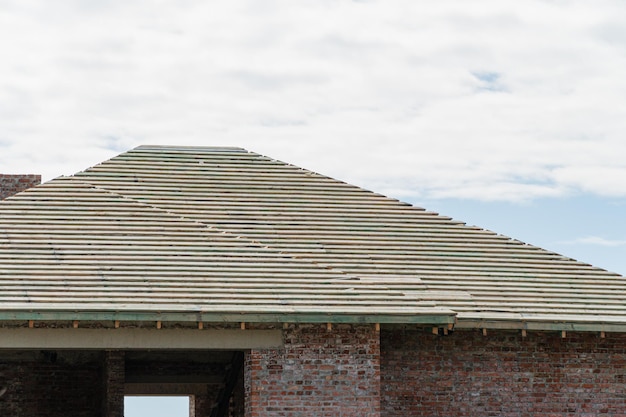 Construction of a red brick house The house is not covered with metal tiles Roof construction