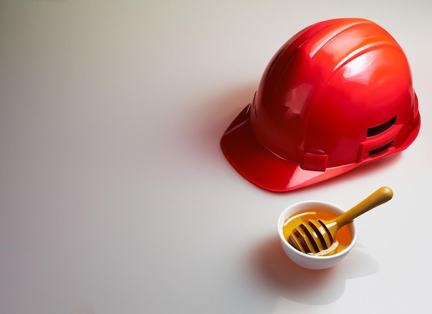 Construction red helmet with honey bowl