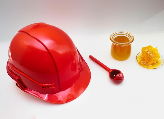 Construction red helmet with honey bowl